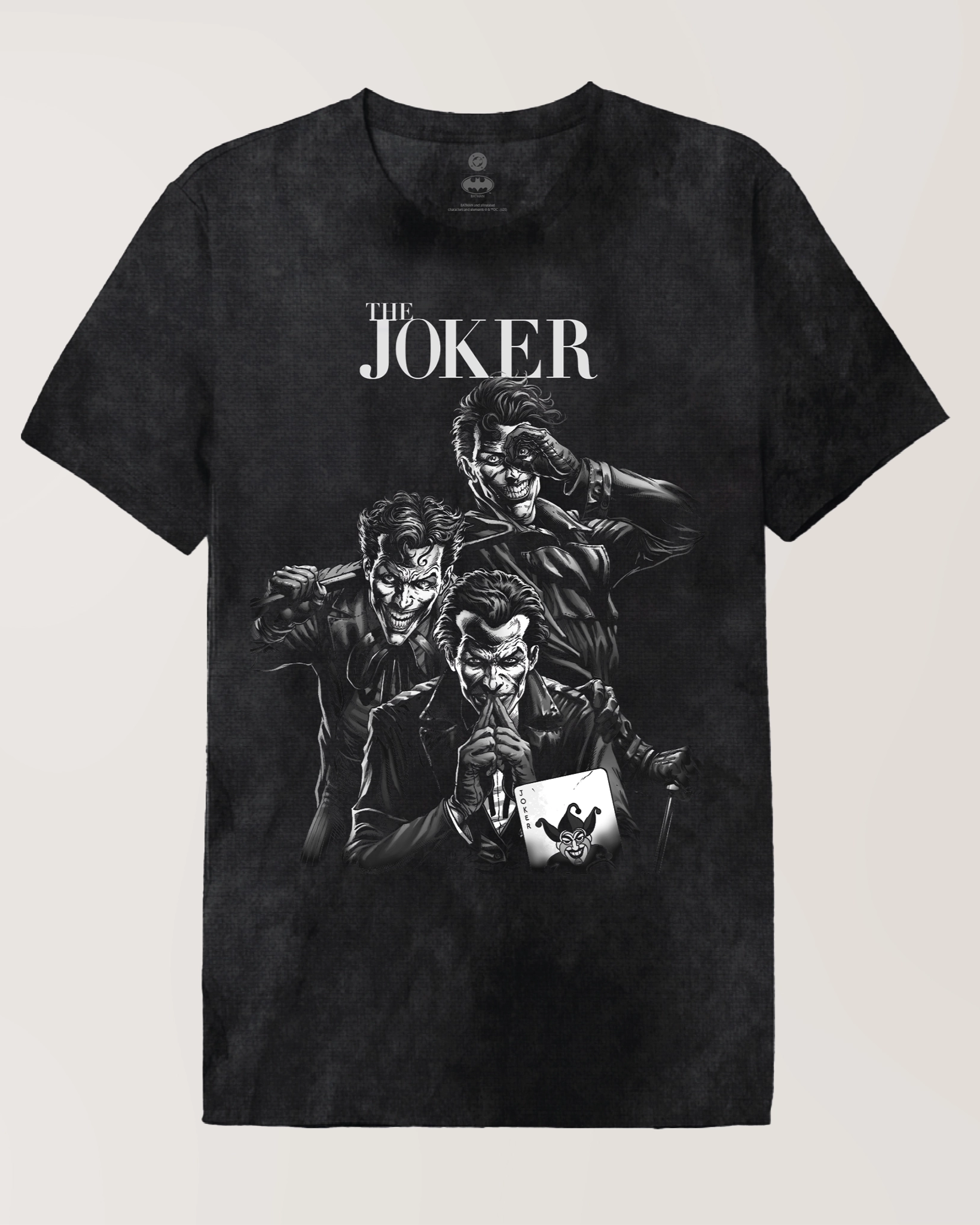 T-shirt DC Comics Joker - THE JOKER à plat, avec trois Jokers menaçants en illustration monochrome et logo THE JOKER en haut.